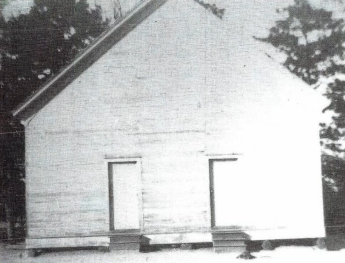 Original Pleasant Grove Baptist Church building with two front doors, circa 1889